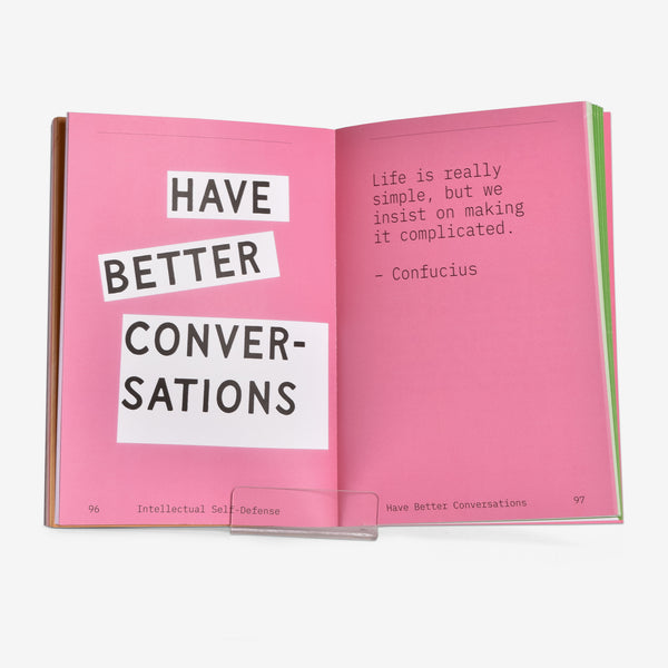Open book with pink pages displaying the opening chapter text for a chapter called Have Better Conversations and a Confucius quote.