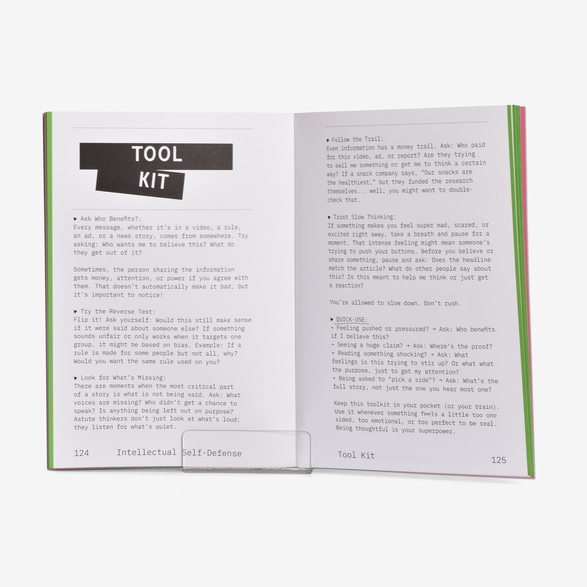 Open book showing pages with text and a 'Tool Kit' a quick guide for critical thinking section.