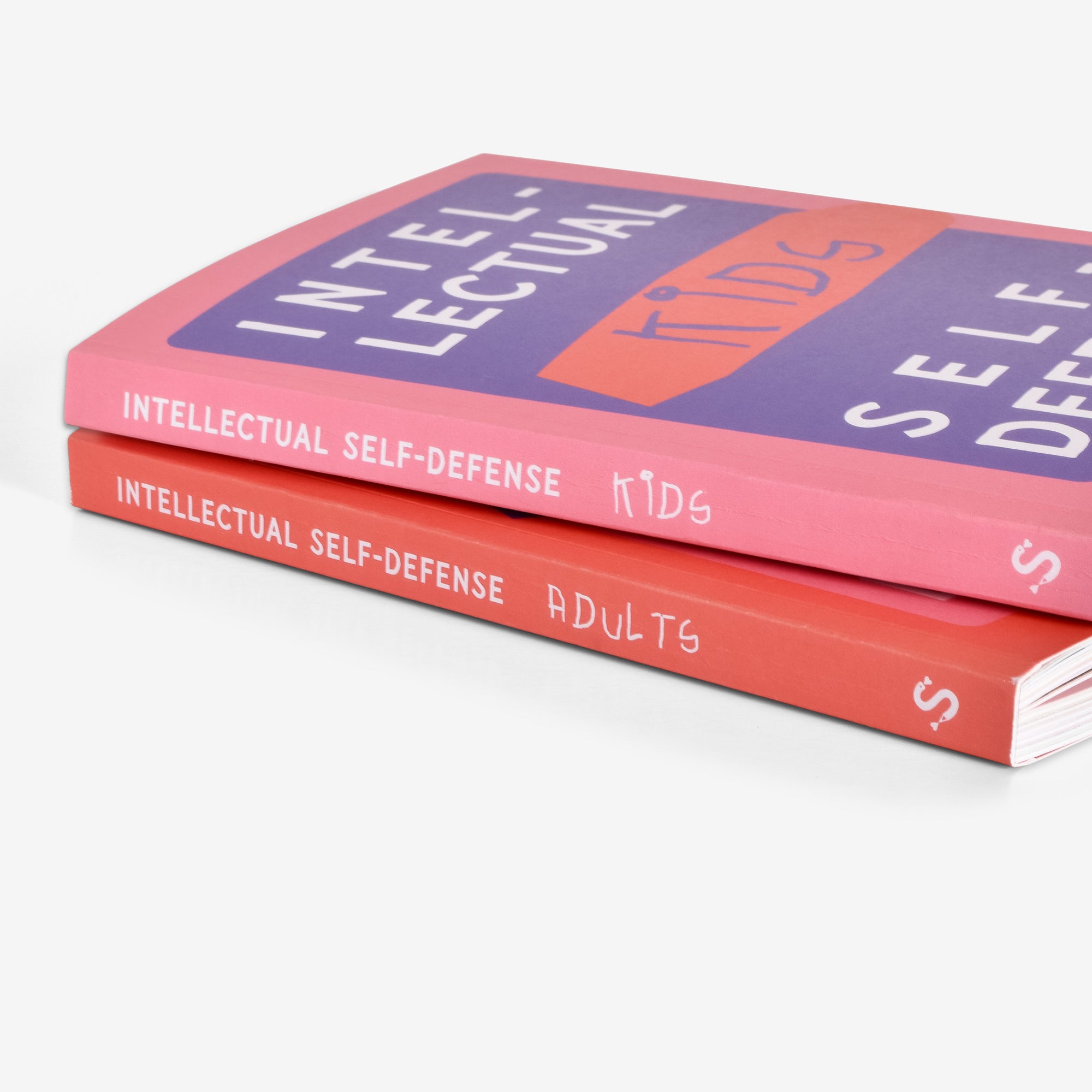 Two books stacked one on over the other titled 'Intellectual Self-Defense' and introduction to critical thinking for kids and adults on a white background