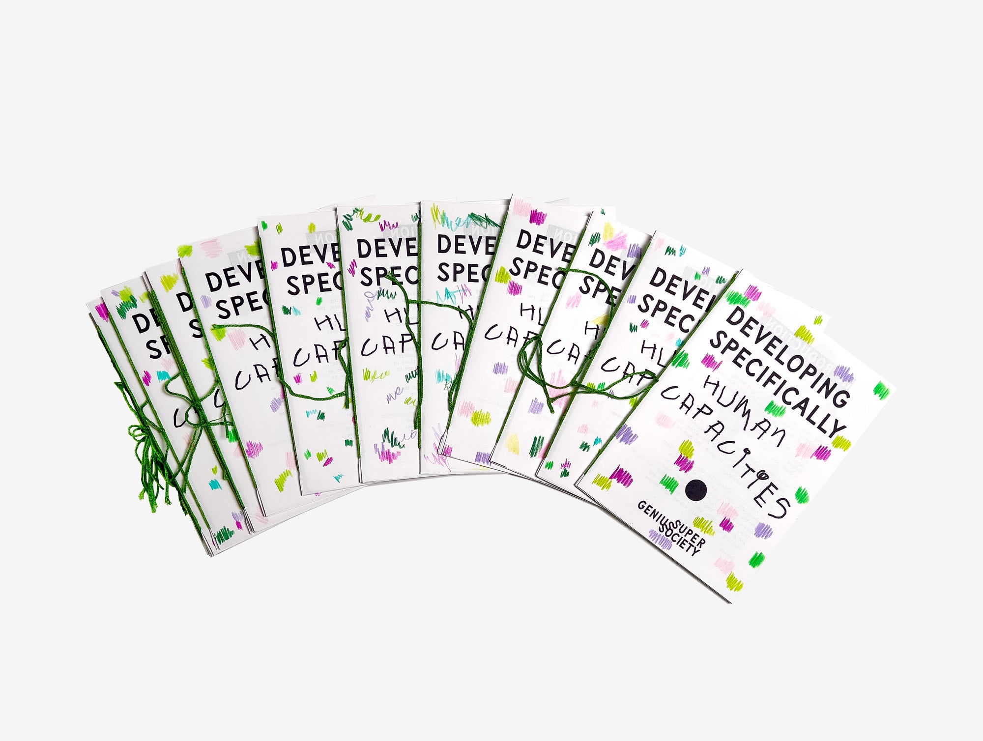 Set of educational zines called Developing Specifically Human Capacities from Super Genius Society with text hand made scribbles + binding and graphics on a white background