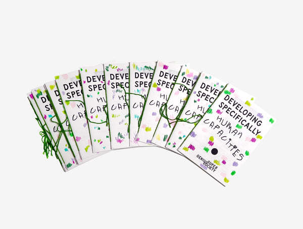 Set of educational zines called Developing Specifically Human Capacities from Super Genius Society with text hand made scribbles + binding and graphics on a white background