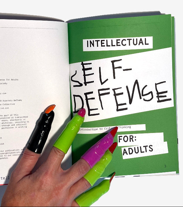 Book titled 'Intellectual Self-Defense for Adults' with a hand with play witch fingertips holding it open.