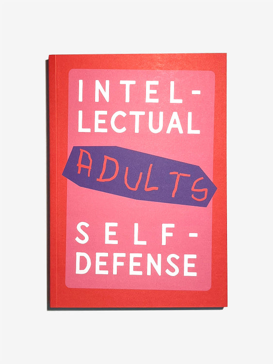 Book titled 'Intellectual Self-Defense Adults' with a red cover and pink text on a white background 