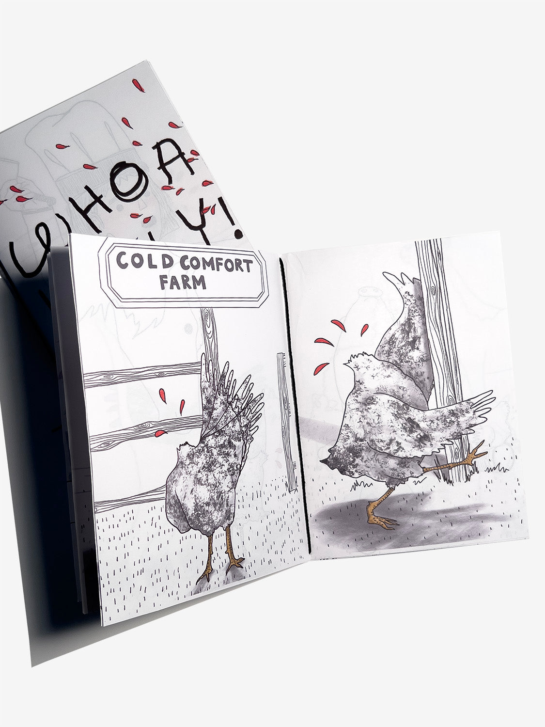 Open zine with illustrations of a headless chicken waving and then bumping onto a wooden pole and text 'Cold Comfort Farm' on a white background.