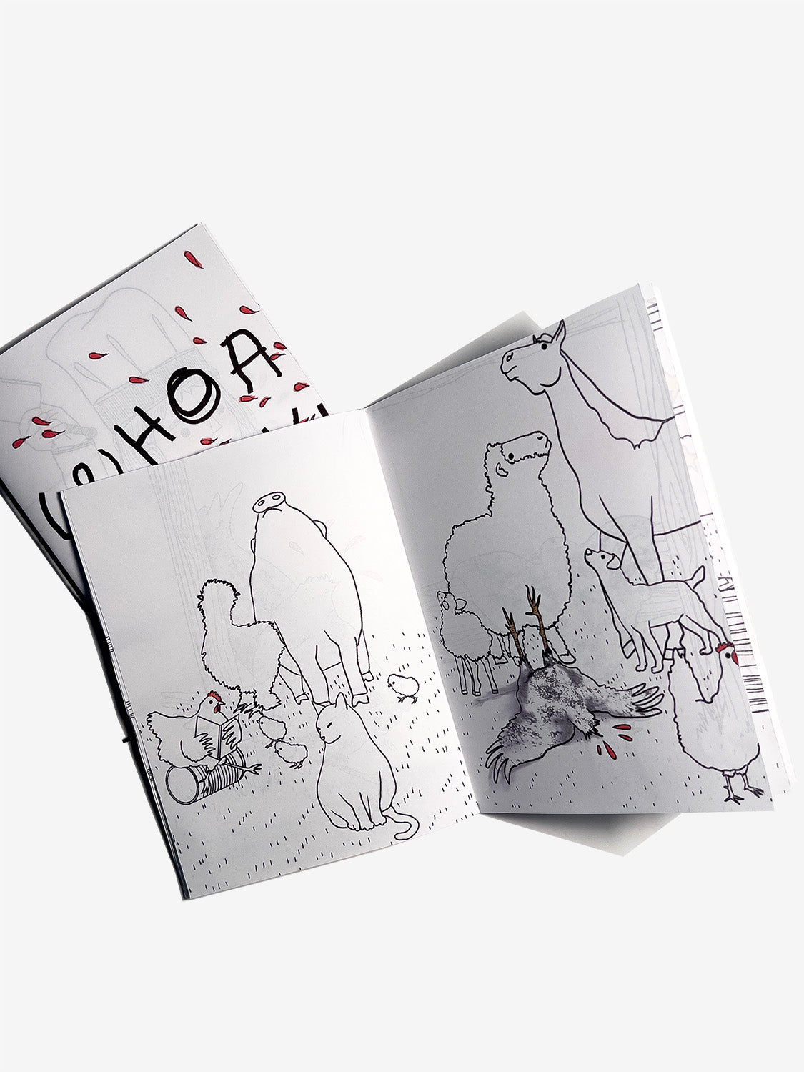 Two zines one open to a page with animal illustrations ignoring a falling headless chicken on the ground on a white background